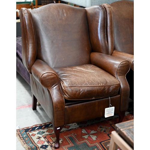 124 - A pair of brown leather Laura Ashley recliner wingback armchairs (2)