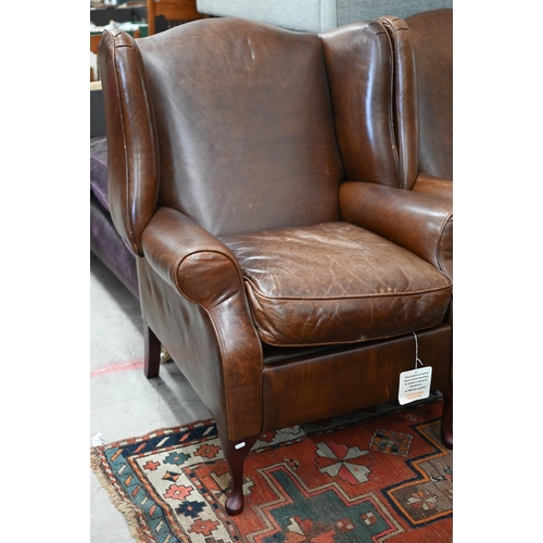 124 - A pair of brown leather Laura Ashley recliner wingback armchairs (2)