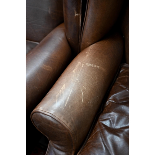 124 - A pair of brown leather Laura Ashley recliner wingback armchairs (2)