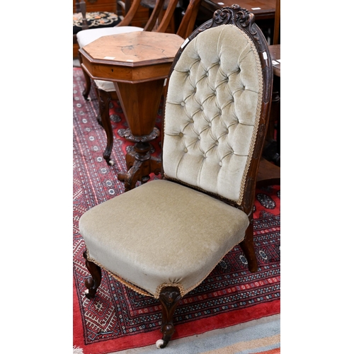 129 - # A Victorian carved mahogany nursing chair, green dralon button back upholstered