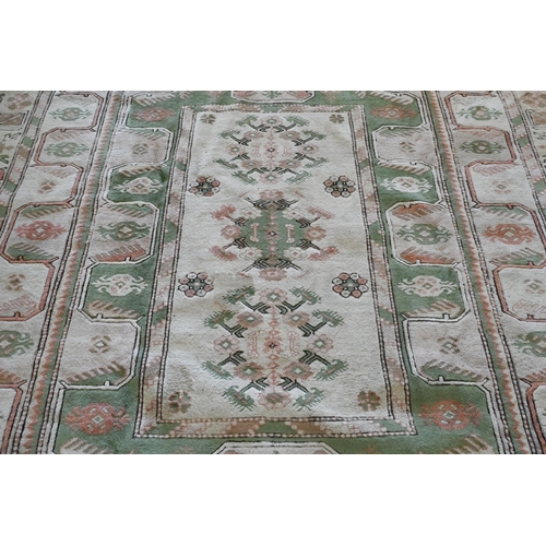 131 - A Turkish Milas carpet in pastel hues with geometric design