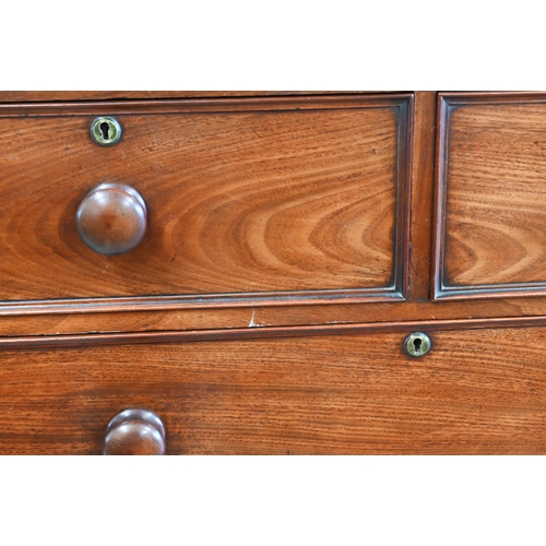 132 - A 19th century mahogany chest of drawers of two short over three long drawers with turned handles an... 