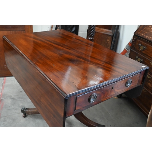 133 - # A 19th century mahogany drop leaf table with drawer to one end and opposing dummy drawer, with tur... 