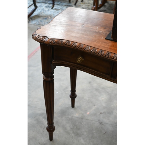 138 - A hardwood serpentine front hall table with three drawers and reeded supports, 100 x 38 x 76 cm high