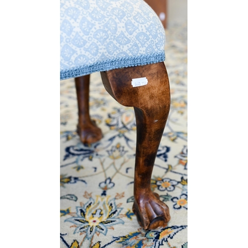 141 - A walnut framed footstool with blue and white patterned fabric and cabriole supports, 108 x 40 x 42 ... 