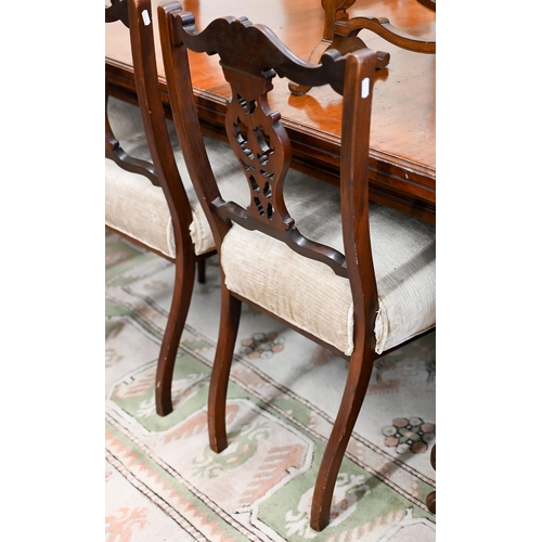 144 - A set of Edwardian mahogany side chairs by Heals with champagne chenile overstuffed seats on turned ... 