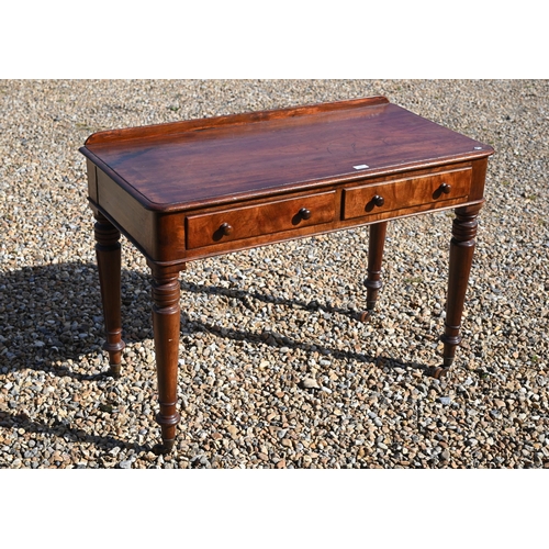 151 - A 19th century mahogany two drawer side table on turned supports with castors, 105 x 54 x 75 cm high