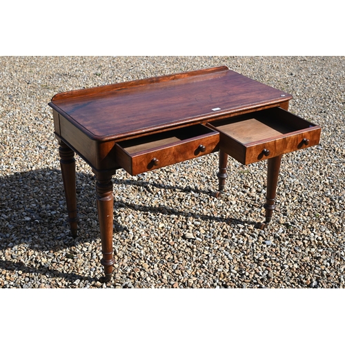 151 - A 19th century mahogany two drawer side table on turned supports with castors, 105 x 54 x 75 cm high