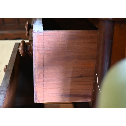 152 - A 19th century mahogany wardrobe with central arched mirror between panelled doors on a four drawer ... 