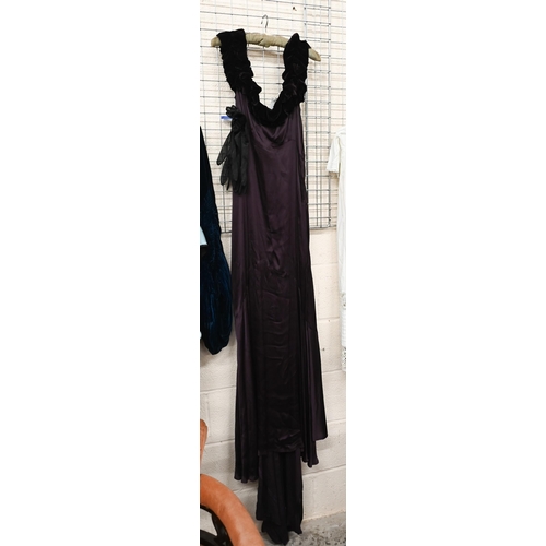 177 - A vintage long evening gown in deep purple with velvet off-the shoulder ruffle and bias-cut skirt, a... 