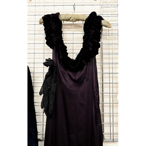 177 - A vintage long evening gown in deep purple with velvet off-the shoulder ruffle and bias-cut skirt, a... 