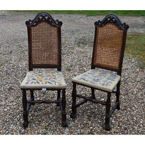 180 - A pair of antique cane backed side chairs with floral tapestry seats (2)