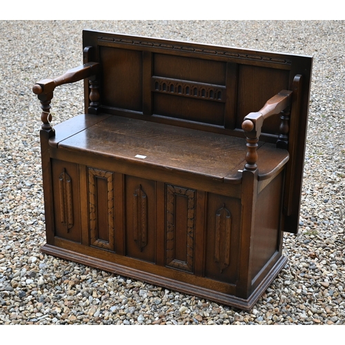 191 - A carved oak box seated Monk's bench, of panelled construction, 100 x 45 x 80 cm high