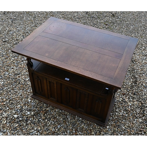 191 - A carved oak box seated Monk's bench, of panelled construction, 100 x 45 x 80 cm high