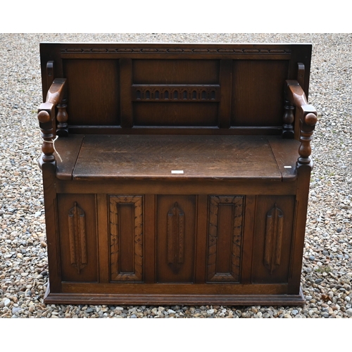 191 - A carved oak box seated Monk's bench, of panelled construction, 100 x 45 x 80 cm high