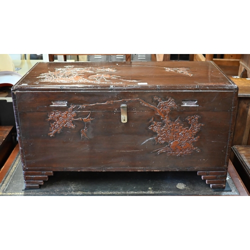 196 - A Chinese camphorwood trunk carved with birds, bamboo and prunus, 94 x 44 x 50 cm high