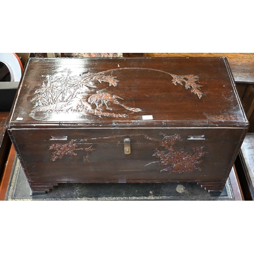 196 - A Chinese camphorwood trunk carved with birds, bamboo and prunus, 94 x 44 x 50 cm high