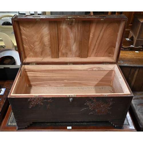 196 - A Chinese camphorwood trunk carved with birds, bamboo and prunus, 94 x 44 x 50 cm high