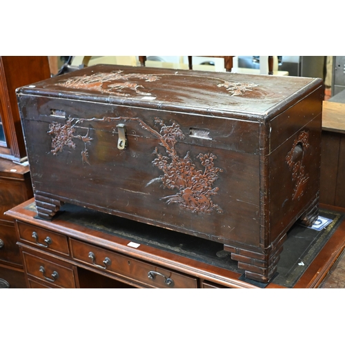 196 - A Chinese camphorwood trunk carved with birds, bamboo and prunus, 94 x 44 x 50 cm high