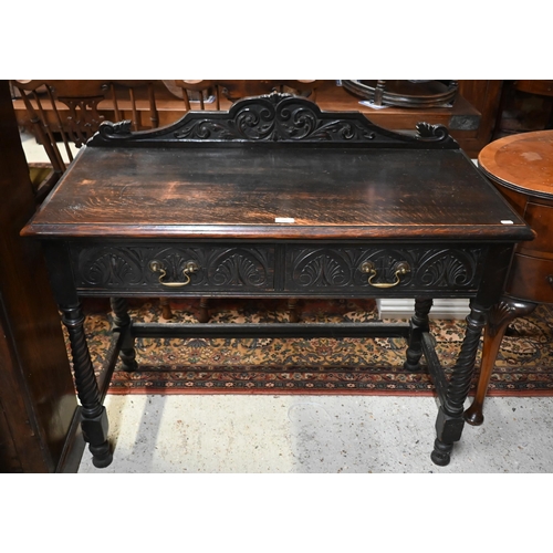 205 - An early 20th century carved oak hall table with two drawers and spiral turned supports united by st... 