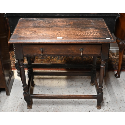 206 - An antique oak side table with single drawer, on turned supports and stretchers, 76 x 45 x 74 cm hig... 