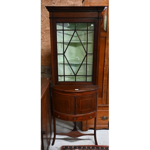 221 - # An inlaid mahogany floor standing part-glazed corner cabinet, 60 x 175 cm high