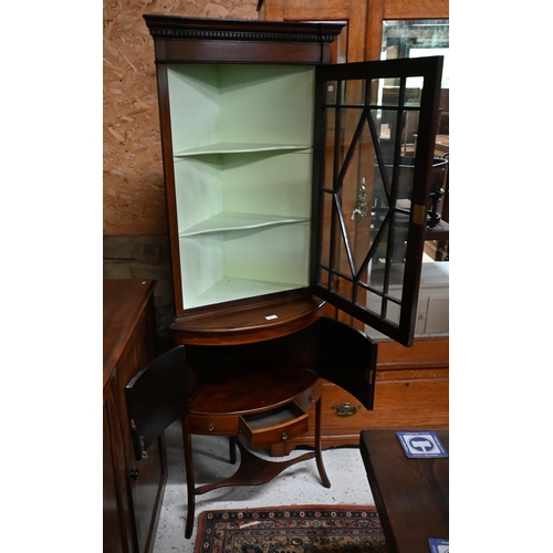 221 - # An inlaid mahogany floor standing part-glazed corner cabinet, 60 x 175 cm high