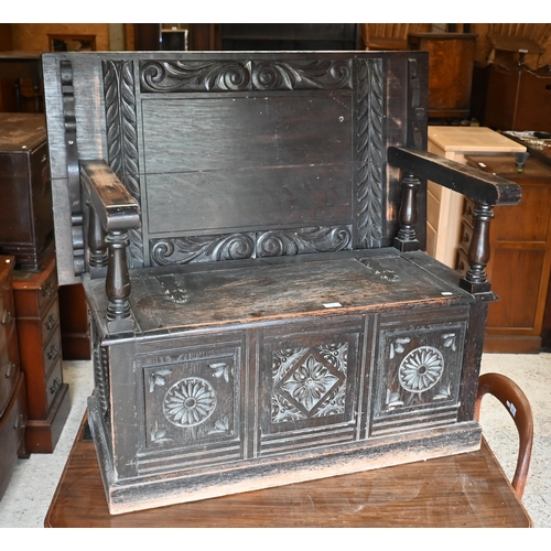 232 - An early 20th century carved oak monk's bench, box seat with 'Cavendish House, Cheltenham' plaque to... 