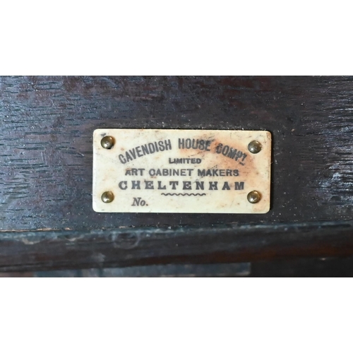 232 - An early 20th century carved oak monk's bench, box seat with 'Cavendish House, Cheltenham' plaque to... 