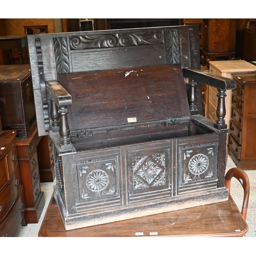 232 - An early 20th century carved oak monk's bench, box seat with 'Cavendish House, Cheltenham' plaque to... 