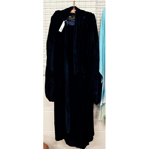 242 - A vintage Debenham Freebody dark blue velvet lady's evening coat with balloon sleeves and scarf tie ... 