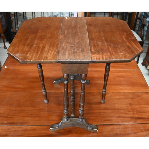 247 - An early 20th century table-top revolving bookcase with penwork muscial trophy to the top to/w mahog... 