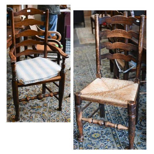 251 - A set of four provincial ash wavy ladderback dining chairs with rush seats, 3 standard and 1 carver ... 