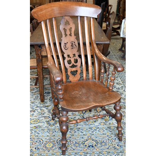 252 - An antique elm seated Windsor chair