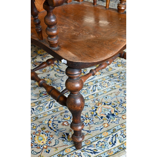 252 - An antique elm seated Windsor chair