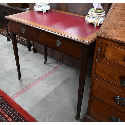 258 - # An antique mahogany two drawer writing table, on square tapering supports with casters, 92 x 52 x ... 