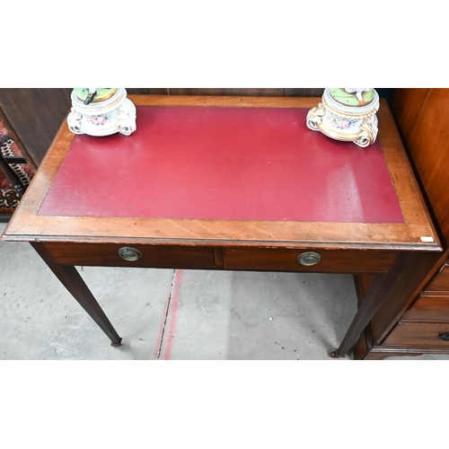 258 - # An antique mahogany two drawer writing table, on square tapering supports with casters, 92 x 52 x ... 