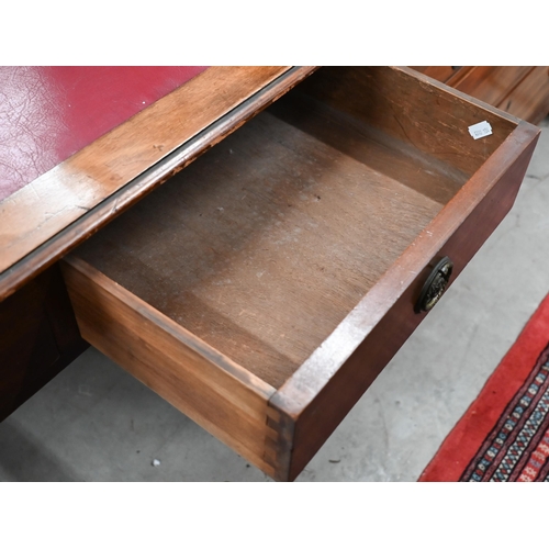 258 - # An antique mahogany two drawer writing table, on square tapering supports with casters, 92 x 52 x ... 