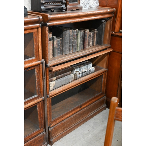 262 - Four oak Globe Wernicke library bookcases, the largest with four graduated glazed in sections, on a ... 