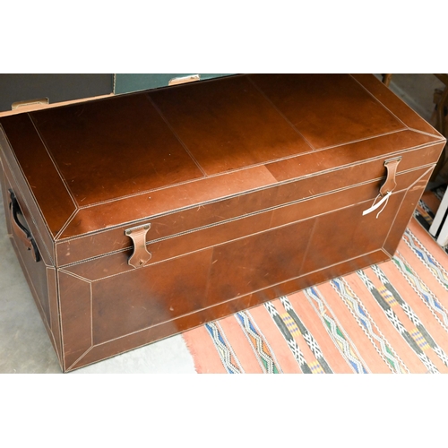 264 - A contemporary brown leather-bound blanket chest, with carrying handles to sides, the interior with ... 