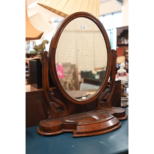 268 - # An Edwardian mahogany framed dressing table mirror with oval plate on a platform base with lidded ... 