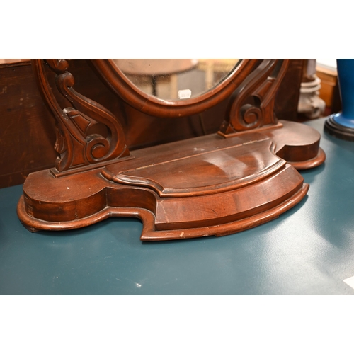 268 - # An Edwardian mahogany framed dressing table mirror with oval plate on a platform base with lidded ... 