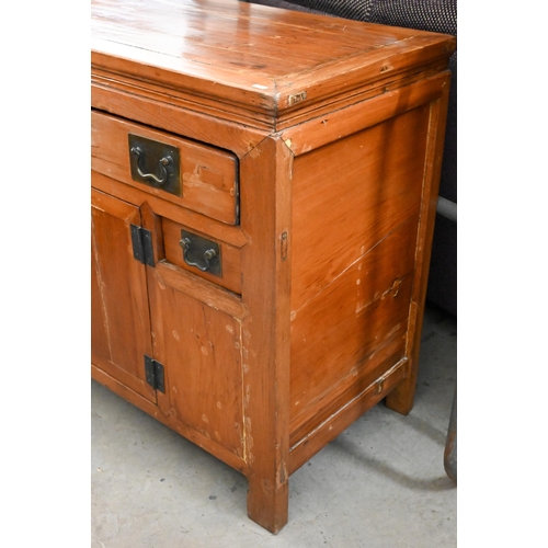 271 - An oriental elm cabinet with an arrangement of five drawers and centred by a pair of cabinets, 130 c... 