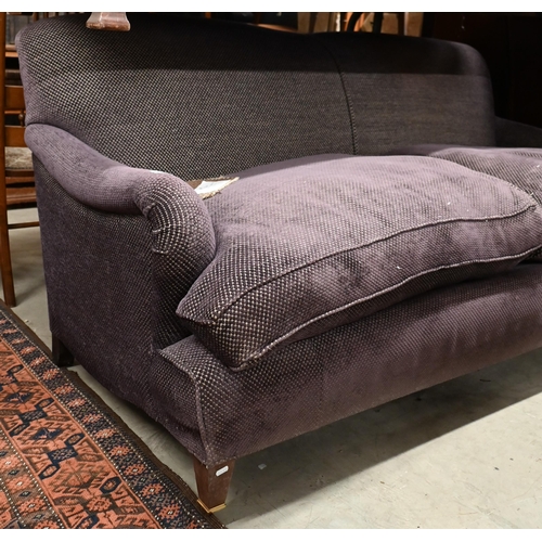 272 - A modern Howard style three seat sofa, upholstered in Fleurons d'Helane Wilton damson fabric, raised... 