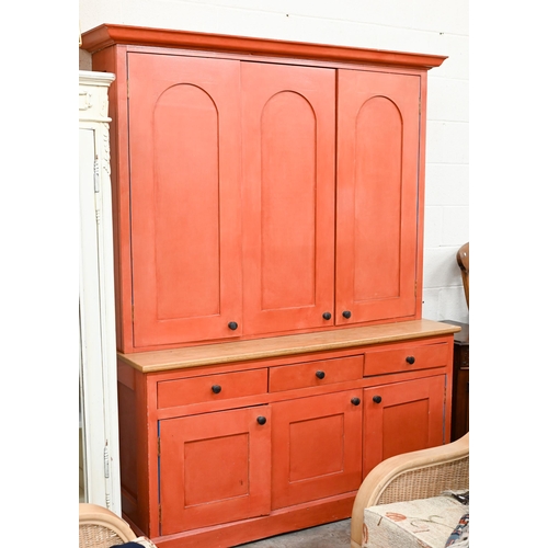 279 - A contemporary painted oak top kitchen cupboard, with three arched panel doors over three drawers an... 