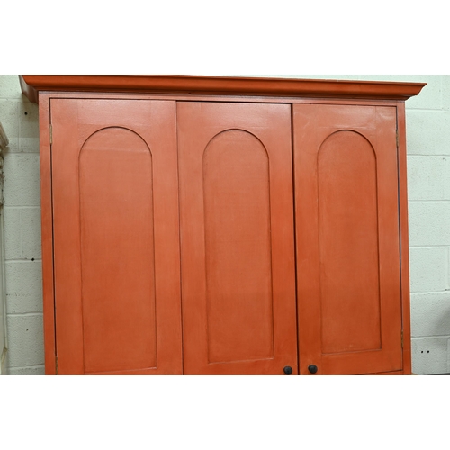 279 - A contemporary painted oak top kitchen cupboard, with three arched panel doors over three drawers an... 