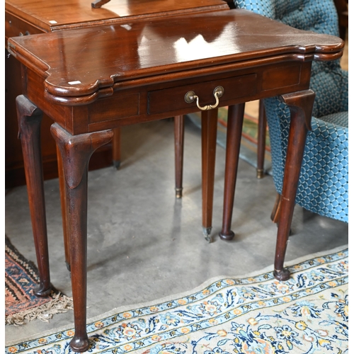 282 - A Victorian mahogany lobed corner fold over card table, with twin gate-legs and frieze drawer, raise... 