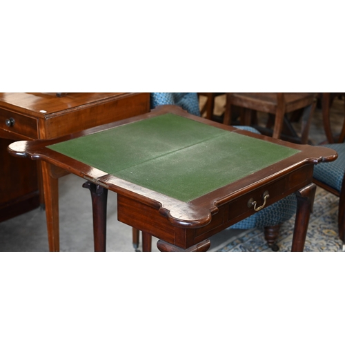 282 - A Victorian mahogany lobed corner fold over card table, with twin gate-legs and frieze drawer, raise... 