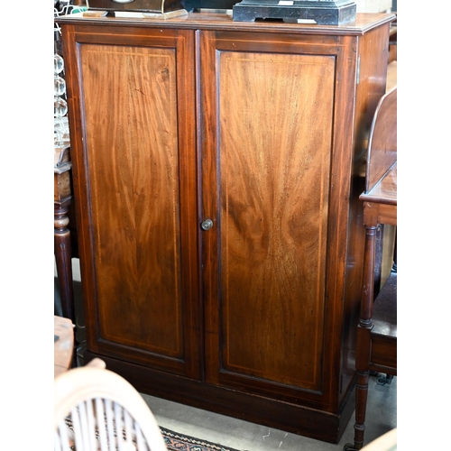 283 - An Edwardian cross-banded satinwood two door cabinet with adjustable shelves, on a plinth base, 92 c... 