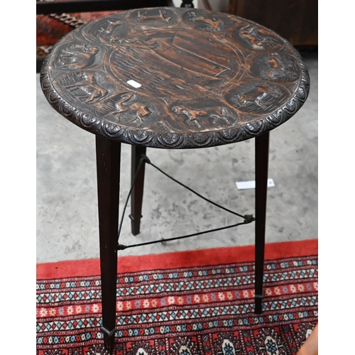 298 - An old carved Indian circular small table, the top with Noah's Ark design, on three turned legs, 42 ... 